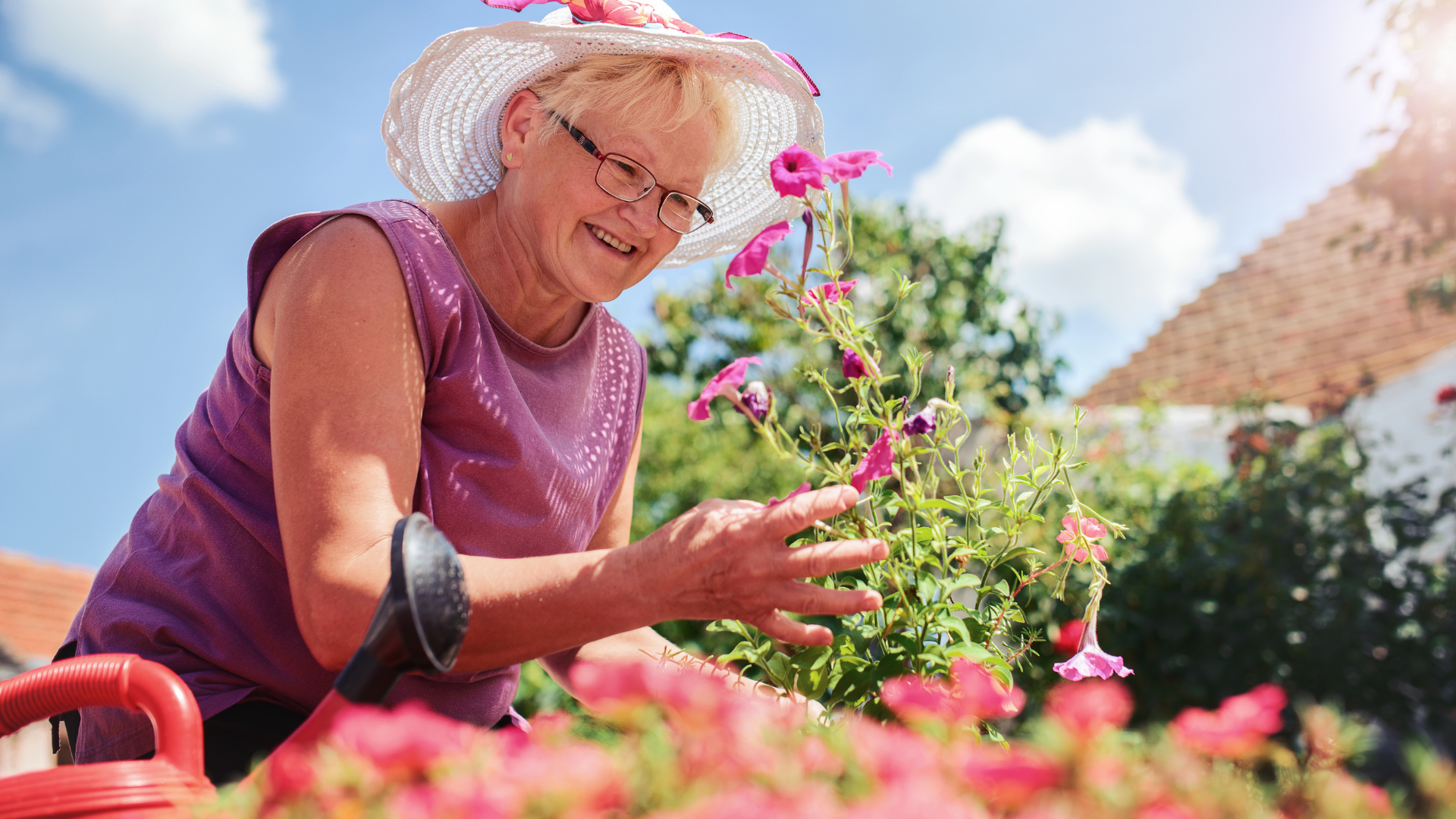 Older adults walking outdoors in a retirement village setting.