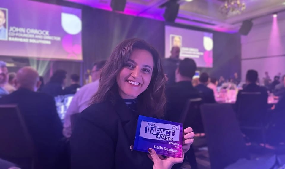 Dalia Raphael with the ESG Leadership Award trophy